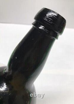 1840s S. F. RUM BOTTLE BLACK GLASS