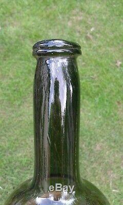 A Lovely Free Blown English Pontilled Black Glass Bottle with Long Neck C1770-80