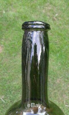 A Lovely Free Blown English Pontilled Black Glass Bottle with Long Neck C1770-80
