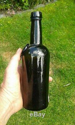 A Lovely Split Size Sealed HWC Black Glass Wine Bottle