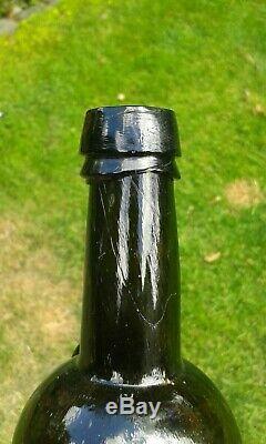 A Lovely Split Size Sealed HWC Black Glass Wine Bottle