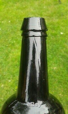 A Stunning Sealed T. C. C. R Trinity College Black Glass Bottle C1830