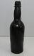 Antique 9 Inch Black Glass Bottle With Pontil On Bottom (inv40273)