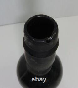 Antique 9 Inch Black Glass Bottle With Pontil On Bottom (inv40273)