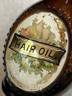 Antique Embossed Label Under Glass Amber Barber Bottle Hair Oil 7.5 (damaged)