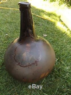 Black glass globular wine bottle pre 1700 with battle scene kent medway chatham