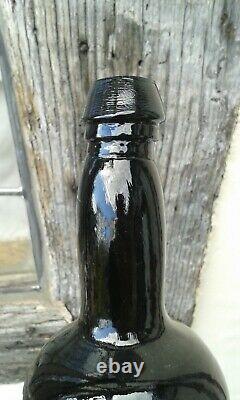 Early Black Glass Blown Sealed T C Wine Bottle
