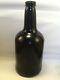 Early Free Blown Squat Cylinder. English Free Blown Black Glass Mallet Bottle