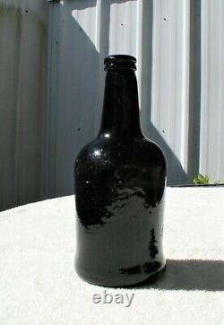 Early Transitional Mallet Black Glass Bottle