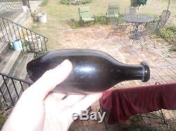 Open pontil black glass torpedo bottle