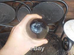 Open pontil black glass torpedo bottle