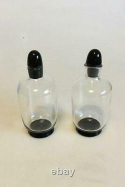 Orrefors Simon Gate Two small Bottles of glass with black base and cork of black