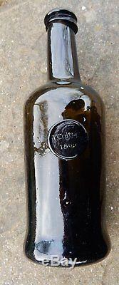 T Coltin / Colton 1804 dated sealed black glass pontilled wine bottle. Unique